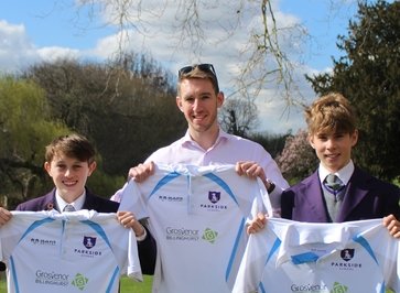 Grosvenor Billinghurst’s Managing Director is joined by Jack P (left), 12, and Luke W (right), 13 to unveil the new team kit for St Lucia